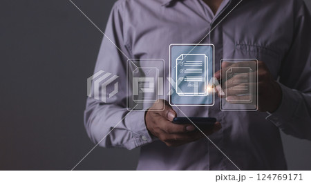 Young man with smartphone mobile hand using a pen touching to sign a Online Business Contract 124769171