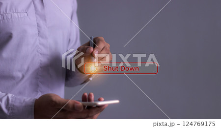 Young man with smartphone hand using a pen touching Shut Down button press power OFF Young man with smartphone hand using a pen touching Shut Down button press power OFF 124769175