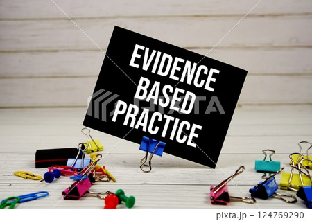 Evidence Based Practice text on paper card with stationary on wooden background Evidence Based Practice text on paper card with stationary on wooden background 124769290