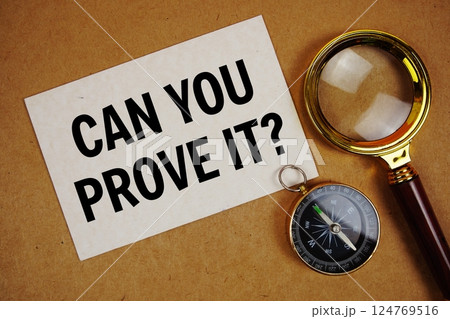 Can You Prove It? text on paper torn with compass and magnifying glass on paper craft background Can You Prove It? text on paper torn with compass and magnifying glass on paper craft background 124769516