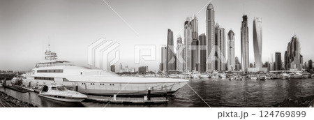 Panoramic view of Dubai Marina bay with yacht and cloudy sky, Dubai, UAE. Panoramic view of Dubai Marina bay with yacht and cloudy sky, Dubai, UAE. 124769899