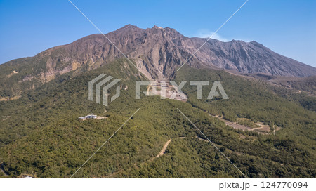 March 23 2025 View of a Lush Forest with Towering Mountain Peaks, Japan March 23 2025 View of a Lush Forest with Towering Mountain Peaks, Japan 124770094