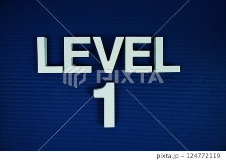 Level 1, Level One alphabet letters on navy blue background Level 1, Level One alphabet letters on navy blue background 124772119