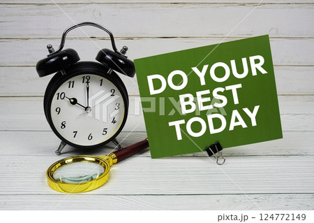 Do Your Best Today text message on paper card with alarm clock on wooden background 124772149