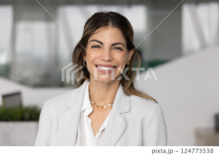 Happy beautiful Hispanic business leader woman posing for head shot 124773538