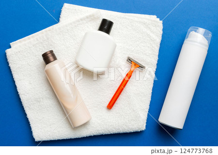 shaving man set. shaving machine, towel, lotion and shaving foam on colored background. Men bath Accessories top view shaving man set. shaving machine, towel, lotion and shaving foam on colored background. Men bath Accessories top view 124773768