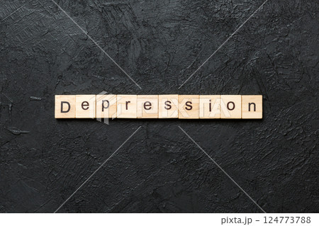 Depression word written on wood block. Depression text on table, concept Depression word written on wood block. Depression text on table, concept 124773788