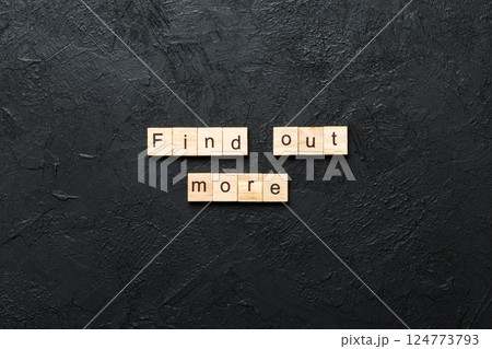 Find out more word written on wood block. Find out more text on cement table for your desing, Top view concept Find out more word written on wood block. Find out more text on cement table for your desing, Top view concept 124773793