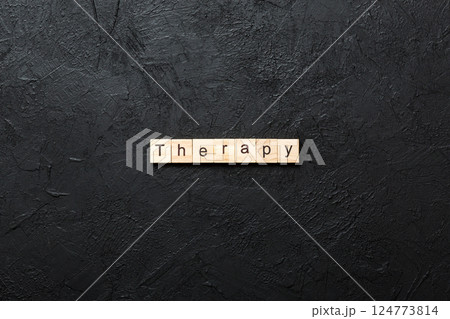 therapy word written on wood block. therapy text on cement table for your desing, concept 124773814