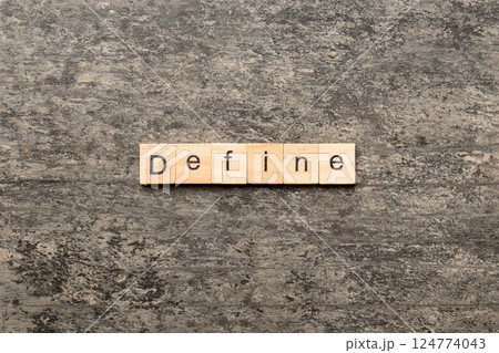 Define word written on wood block. Define text on cement table for your desing, concept Define word written on wood block. Define text on cement table for your desing, concept 124774043