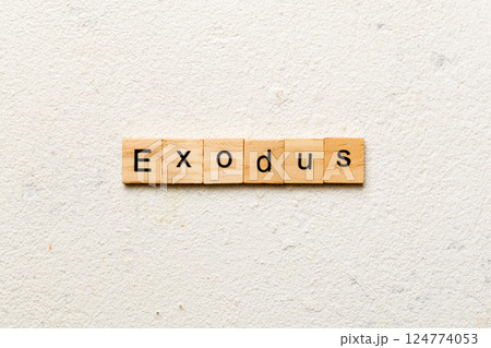 exodus word written on wood block. exodus text on table, concept exodus word written on wood block. exodus text on table, concept 124774053