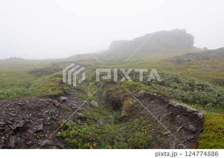 Old abandoned trench in foggy tundra Old abandoned trench in foggy tundra 124774886