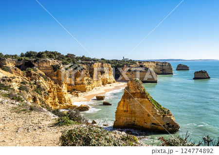 Praia da Marinha Beach among rock islets and cliffs seen from Seven Hanging Valleys Trail, Algarve, Portugal 124774892