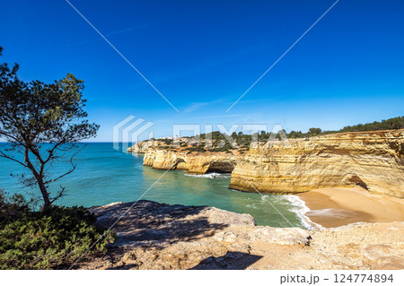 Portuguese coast in Benagil, Algarve, Portugal. Praia da Corredoura. Seven Hangging Valleys Trail. 124774894