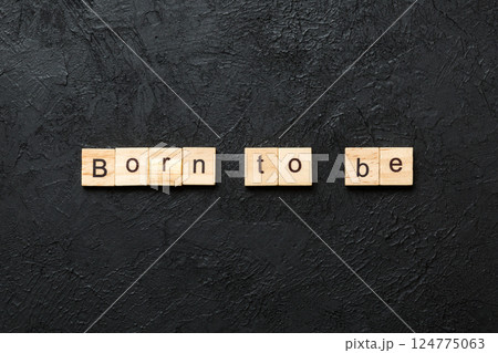 born to be word written on wood block. born to be text on cement table for your desing, concept 124775063