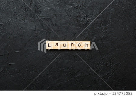 launch word written on wood block. launch text on table, concept 124775082