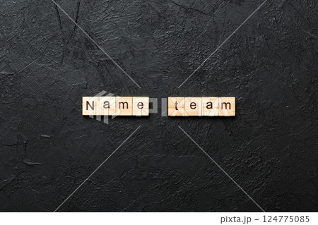 new team word written on wood block. new team text on table, concept 124775085