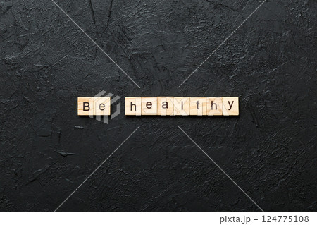 be healthy word written on wood block. be healthy text on table, concept be healthy word written on wood block. be healthy text on table, concept 124775108