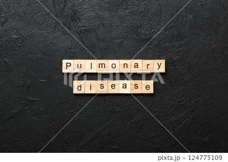 pulmonary disease word written on wood block. pulmonary disease text on table, concept 124775109