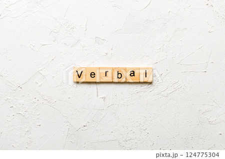 verbal word written on wood block. verbal text on table, concept 124775304