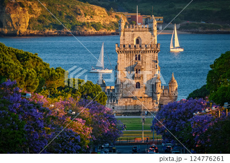 Belem Tower in Lisbon Framed by Blooming Jacaranda Trees and Sailboats on the Tagus River, Portugal 124776261