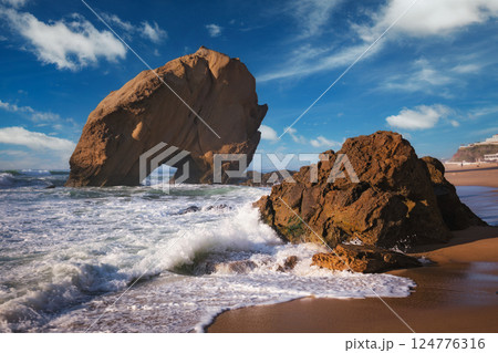 Penedo do Guincho boulder rock at Praia da Santa Cruz, Portugal 124776316