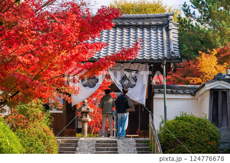 people at Kenninji temple gate with autumn leaf color, Kyoto 124776678
