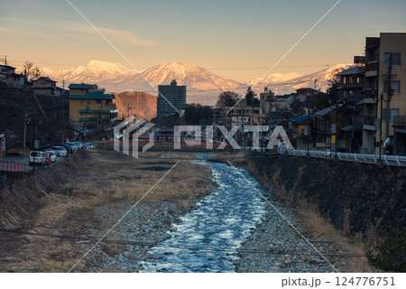 Shibu onsen town with central alps Kiso mountain at sunrise, Nagano Shibu onsen town with central alps Kiso mountain at sunrise, Nagano 124776751