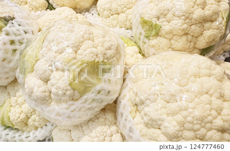 Cauliflower pile in plastic wrap 124777460