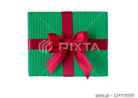 Christmas gift box with satin bow top view isolated on white. Green gift box tied with red silk ribbon. 124778505