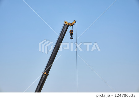 crane boom, machine used to move materials 124780335
