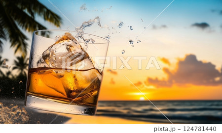 Fresh iced whiskey glass, floating in the air, with tropical beach and palm on the background 124781440