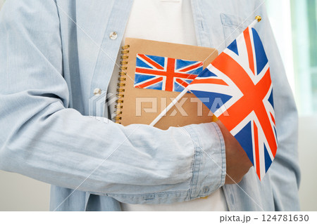 Learn English language, Asian teenage student hold book with flag in course at school. 124781630