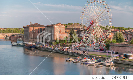 Aerial view of a Ferris wheel at Viguerie Port on the Garonne River timelapse, Toulouse, France 124781935