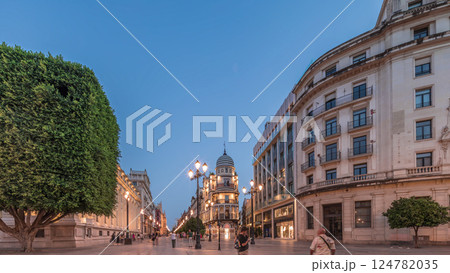 Illuminated Adriatica building on Avenida de la Constitucion at night, Seville, Spain 124782035