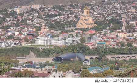 Holy Trinity Cathedral of Tbilisi, the Ceremonial Palace of Georgia and concert hall in Rike Park aerial timelapse. Holy Trinity Cathedral of Tbilisi, the Ceremonial Palace of Georgia and concert hall in Rike Park aerial timelapse. 124782078