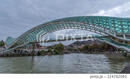 Timelapse of the Bridge of Peace, a bow-shaped pedestrian bridge in Tbilisi, Georgia 124782093