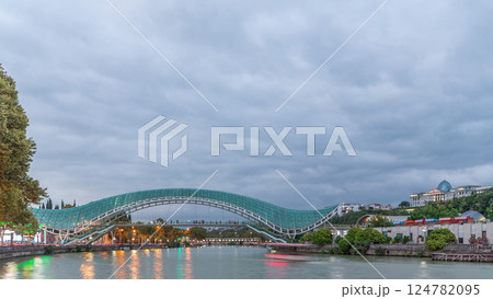 Bridge of Peace day to night timelapse, a bow-shaped pedestrian bridge in Tbilisi, Georgia Bridge of Peace day to night timelapse, a bow-shaped pedestrian bridge in Tbilisi, Georgia 124782095