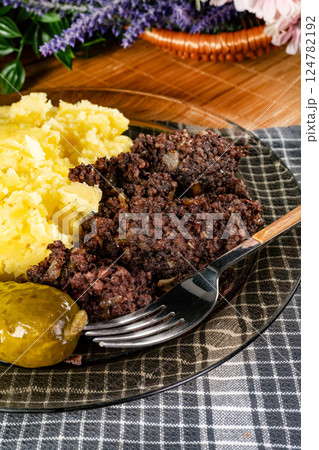 Black pudding with mashed potatoes. Black pudding with mashed potatoes. 124782192