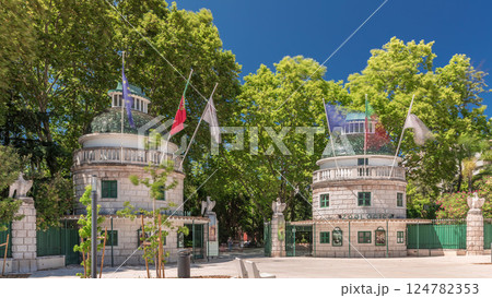 Timelapse hyperlapse of Lisbon Zoo entrance with open gates and flags on towers during summer. Lisbon, Portugal 124782353