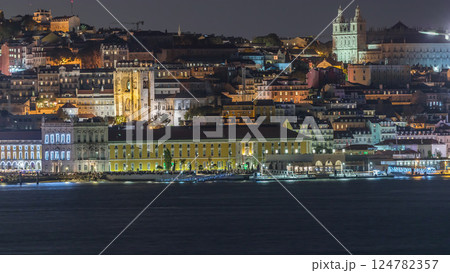 Aerial timelapse of Lisbon's illuminated historic center, Terreiro do Paco and Tagus River at twilight 124782357