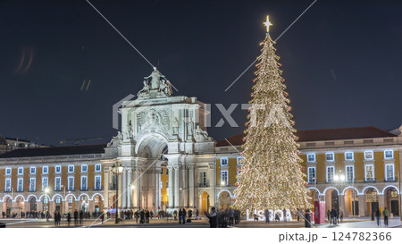 Commerce Square in Lisbon illuminated at Christmas hyperlapse, with a towering tree and crowds celebrating at night. Portugal Commerce Square in Lisbon illuminated at Christmas hyperlapse, with a towering tree and crowds celebrating at night. Portugal 124782366