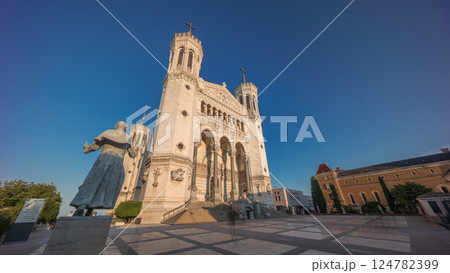 Hyperlapse front view of the Basilica of Notre Dame de Fourviere during sunset in Lyon, France. Hyperlapse front view of the Basilica of Notre Dame de Fourviere during sunset in Lyon, France. 124782399