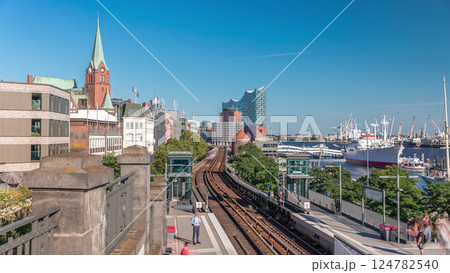 Aerial hyperlapse of trains arriving at Landungsbrucken station in Hamburg, Germany 124782540