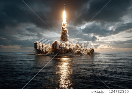 Powerful rocket launching over ocean at sunset with dramatic sky and reflections 124782590