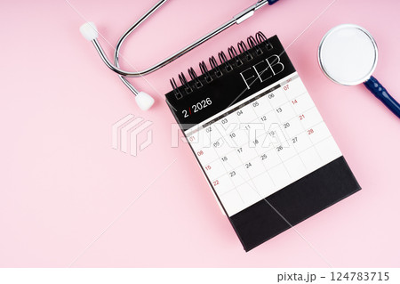 February 2026 desk calendar and stethoscope, Medical appointment schedule. 124783715
