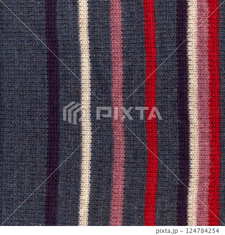 Handmade knitted fabric colored wool background texture, pattern fabric made of wool 124784254