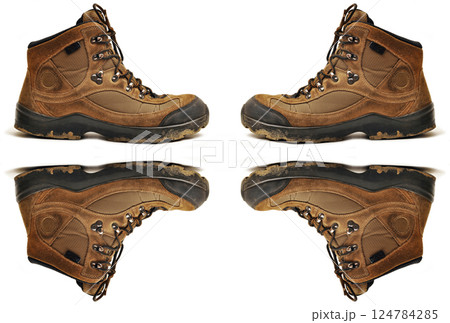 Hiking shoes and a white background, sturdy hiking boots, strong hiking beige and brown boots Hiking shoes and a white background, sturdy hiking boots, strong hiking beige and brown boots 124784285