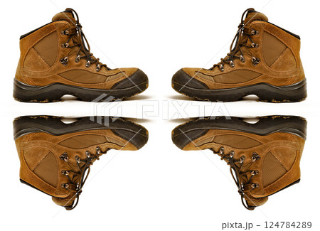 Hiking shoes and a white background, sturdy hiking boots, strong hiking beige and brown boots Hiking shoes and a white background, sturdy hiking boots, strong hiking beige and brown boots 124784289