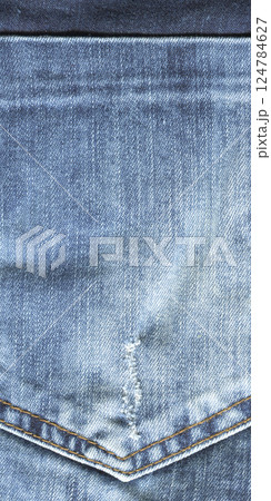 Close up detail of back pocket of light blue jeans Close up detail of back pocket of light blue jeans 124784627